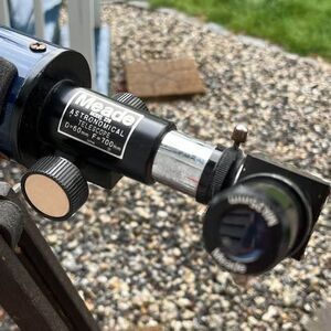 Meade an antique stand and telescope ￼
